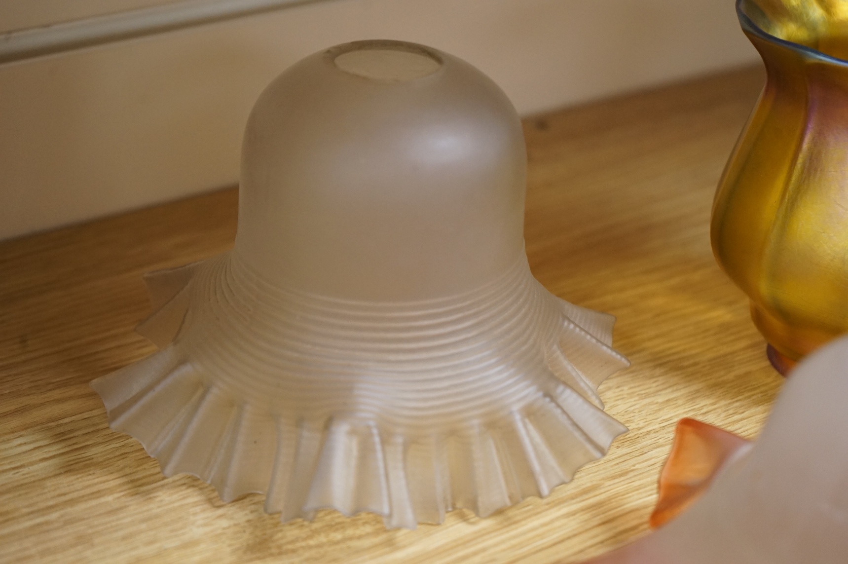 A pair of Quezal Art Glass iridescent light shades, and two frilled edged shades, Quezal shades 11.5cm high